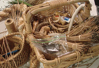 Pine needle bundles and other basket making materials.