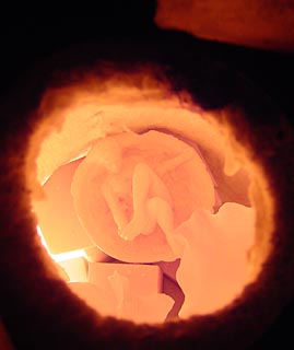 Terry Robinson figure in raku kiln
