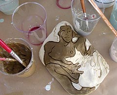 Relaxing with the Cat - applying glazes